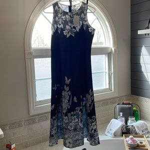 Never worn.  NWT.  Silky smooth material, beautiful design   Simple yet classy.